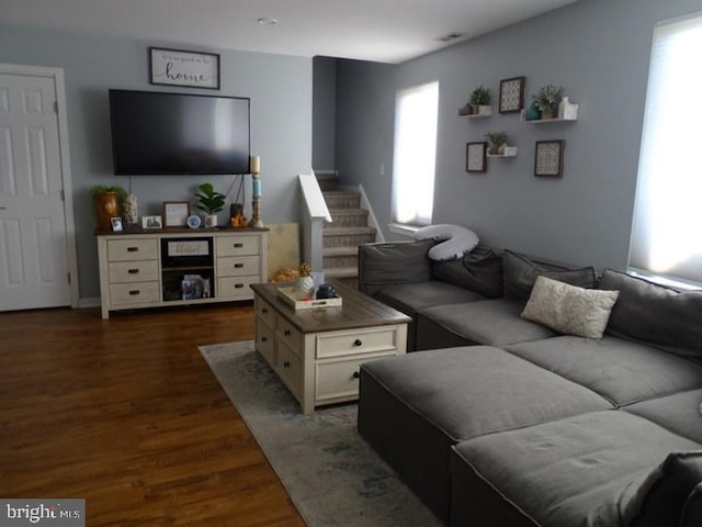 living room with dark hardwood / wood-style floors