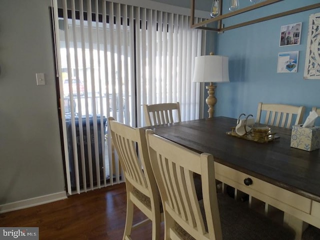 dining space featuring dark hardwood / wood-style flooring