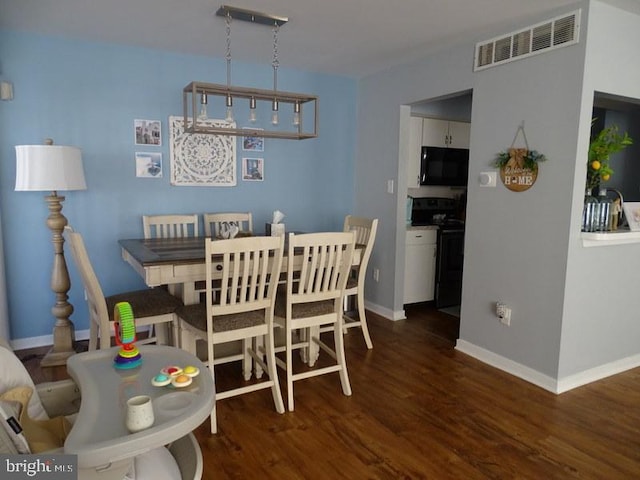 dining room featuring dark wood-type flooring