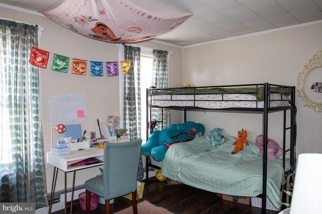 bedroom featuring crown molding and wood-type flooring