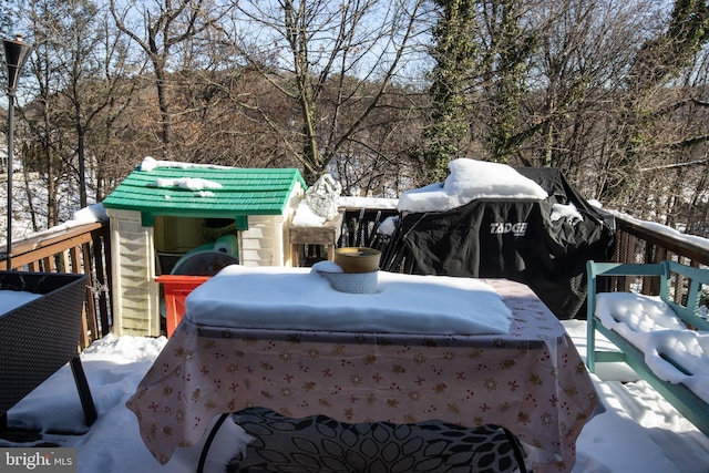 view of snow covered deck