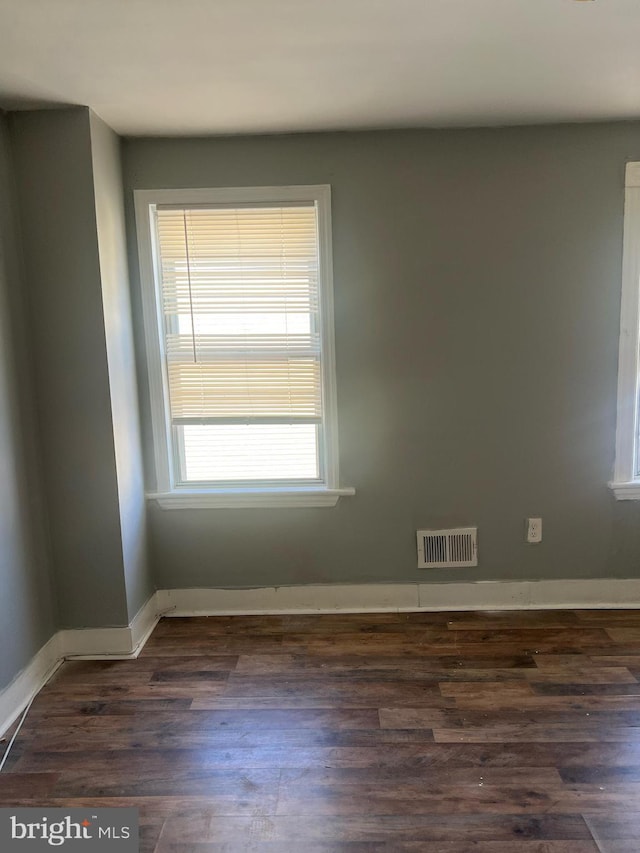 empty room featuring dark hardwood / wood-style floors