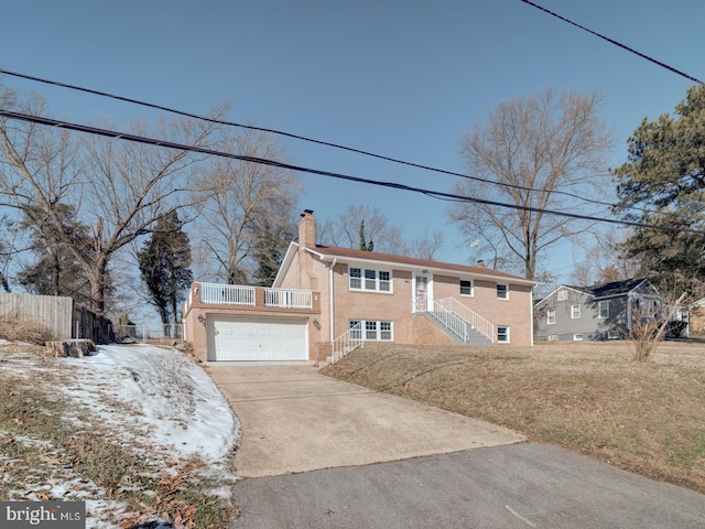 view of front of home with a garage and a front yard