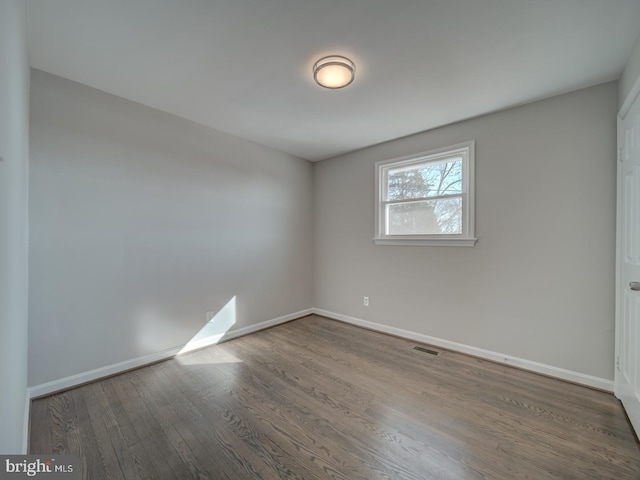 unfurnished room featuring hardwood / wood-style floors