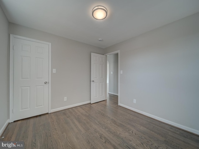 unfurnished bedroom featuring hardwood / wood-style flooring