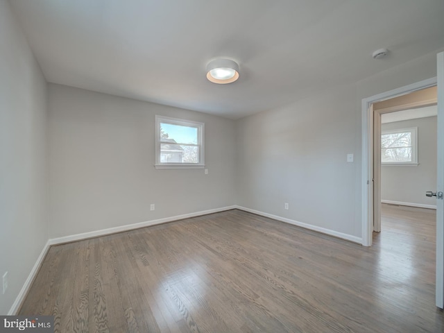 spare room featuring light hardwood / wood-style floors