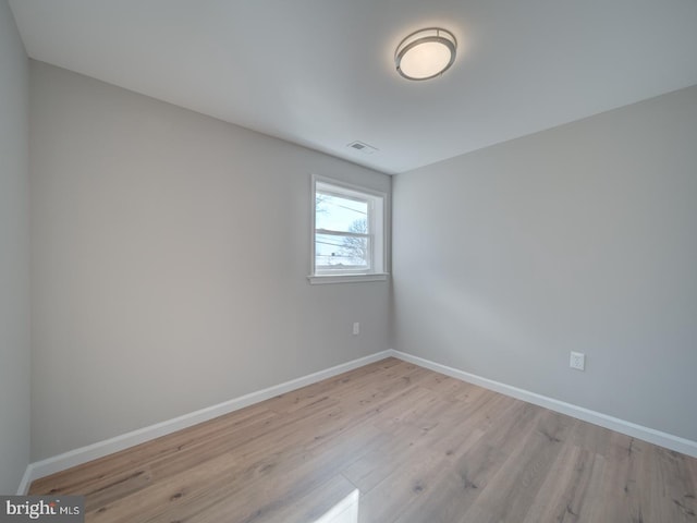 empty room with light hardwood / wood-style floors