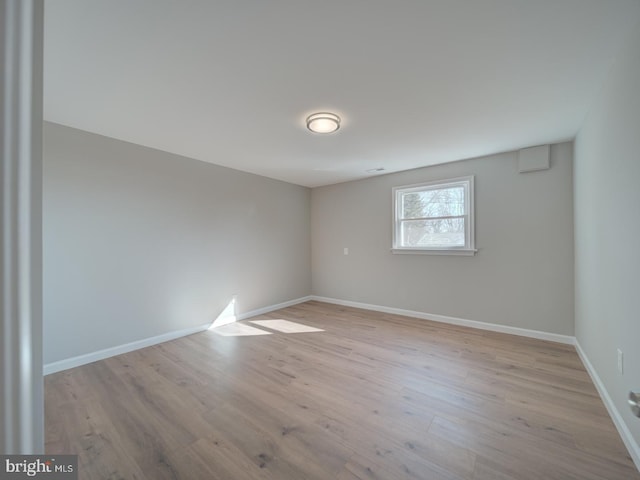 spare room featuring light hardwood / wood-style flooring