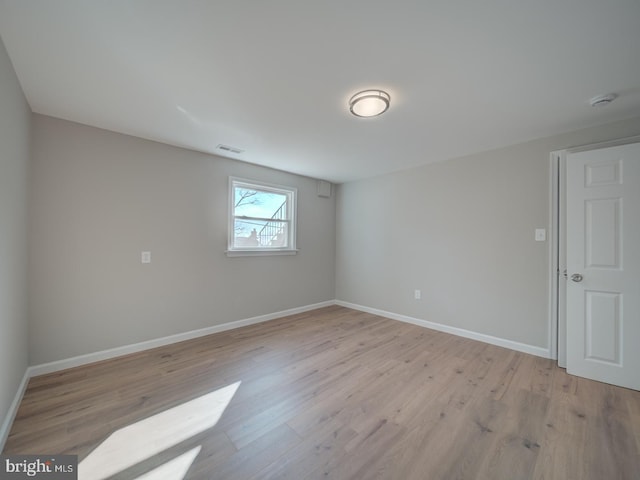 unfurnished room featuring light hardwood / wood-style floors