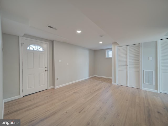 foyer featuring a wealth of natural light and light wood-type flooring