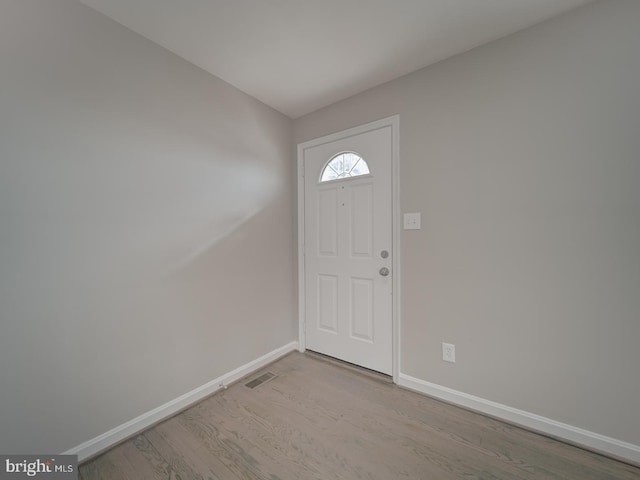 entryway with light hardwood / wood-style floors