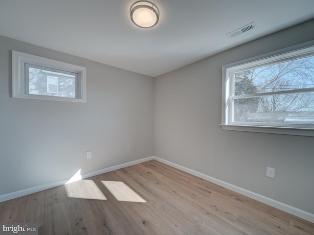 spare room with light wood-type flooring