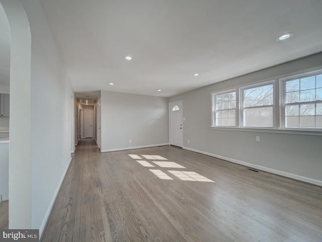 unfurnished living room with light wood-type flooring