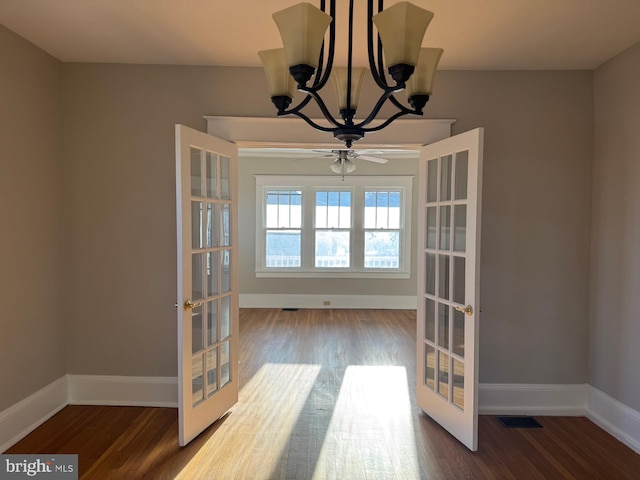 unfurnished dining area with french doors and hardwood / wood-style flooring