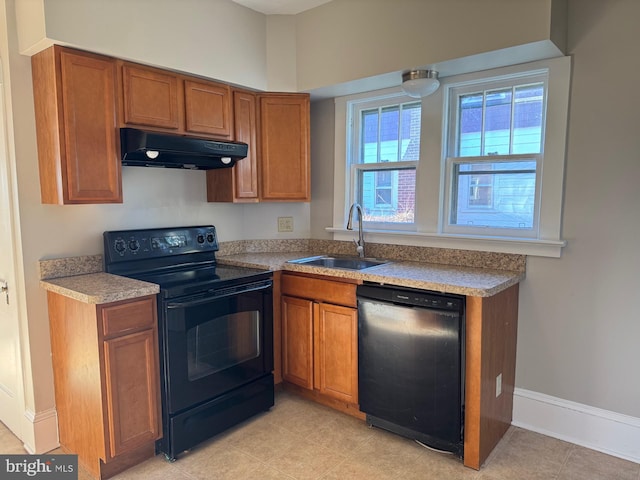 kitchen with sink and black appliances