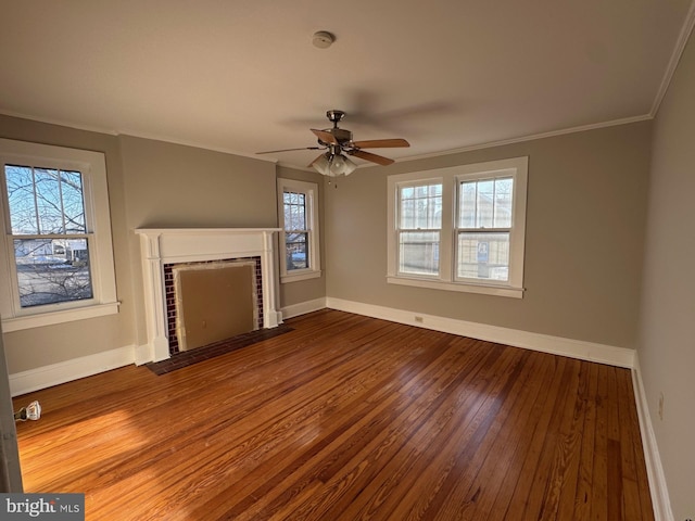 unfurnished living room with ornamental molding, wood-type flooring, and ceiling fan