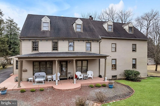 back of house with a yard