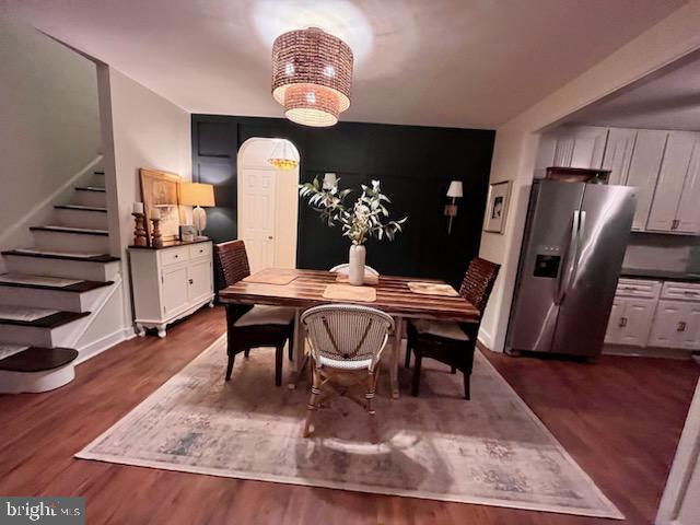 dining space featuring dark hardwood / wood-style floors