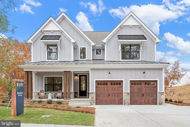 modern farmhouse style home with a garage and covered porch