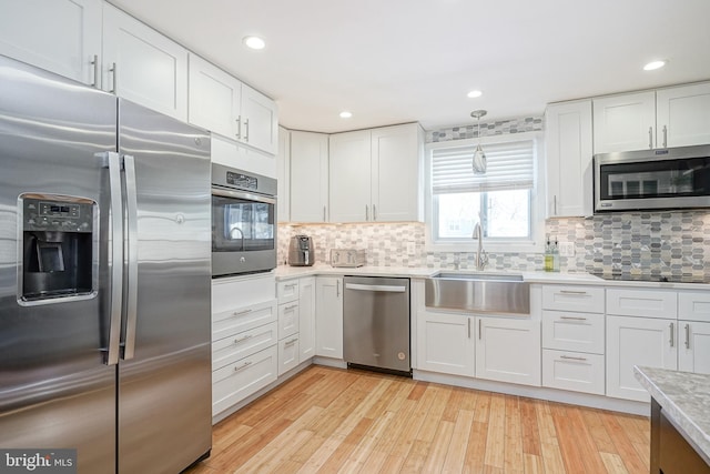 kitchen featuring white cabinets and stainless steel appliances