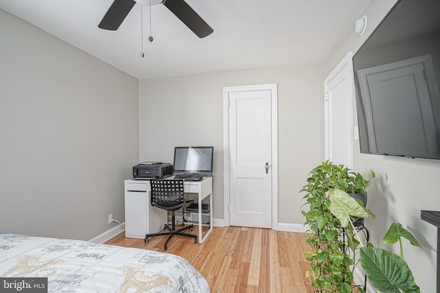 bedroom with light wood-type flooring and ceiling fan