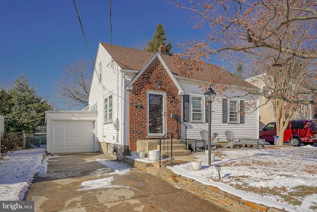 view of front of home with an outdoor structure and a garage