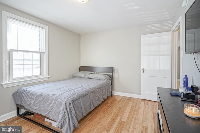 bedroom with light hardwood / wood-style flooring