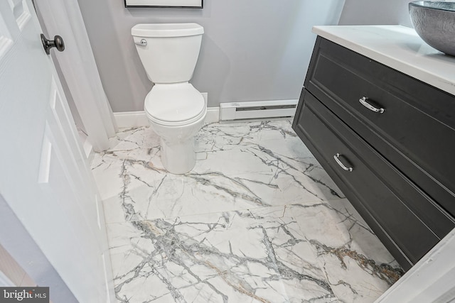 bathroom with a baseboard radiator, toilet, and vanity