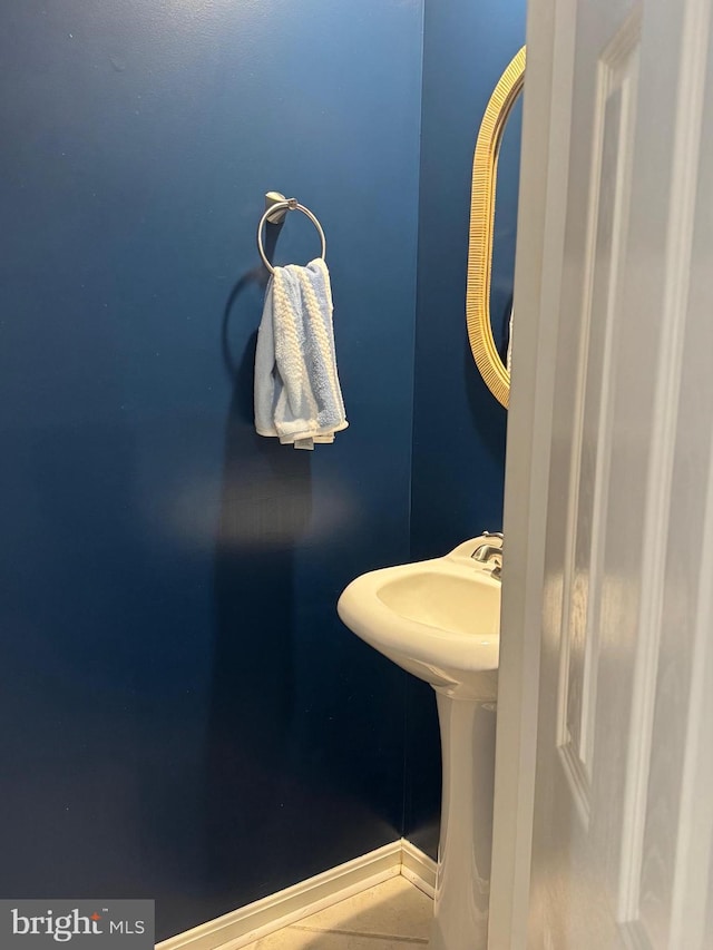 bathroom with tile patterned floors