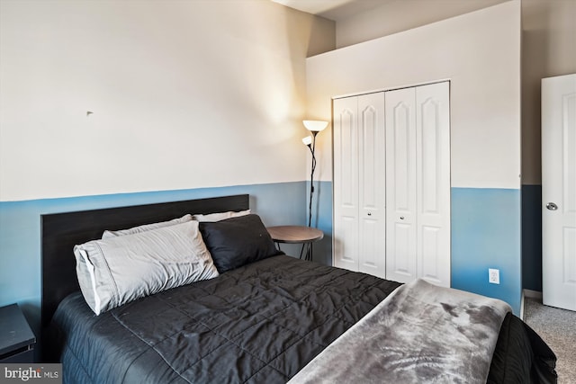 carpeted bedroom featuring a closet