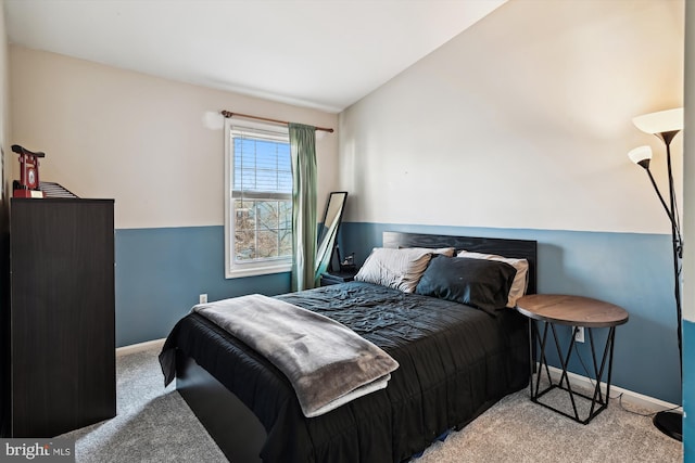 carpeted bedroom featuring vaulted ceiling