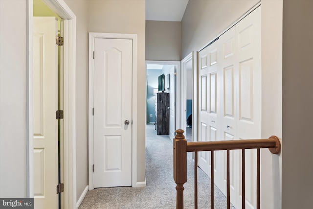 hallway with light carpet