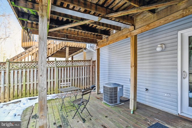 wooden terrace featuring central AC unit