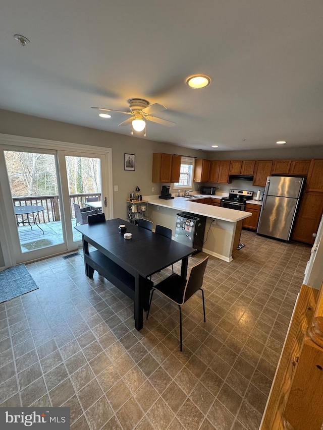 interior space featuring sink and ceiling fan