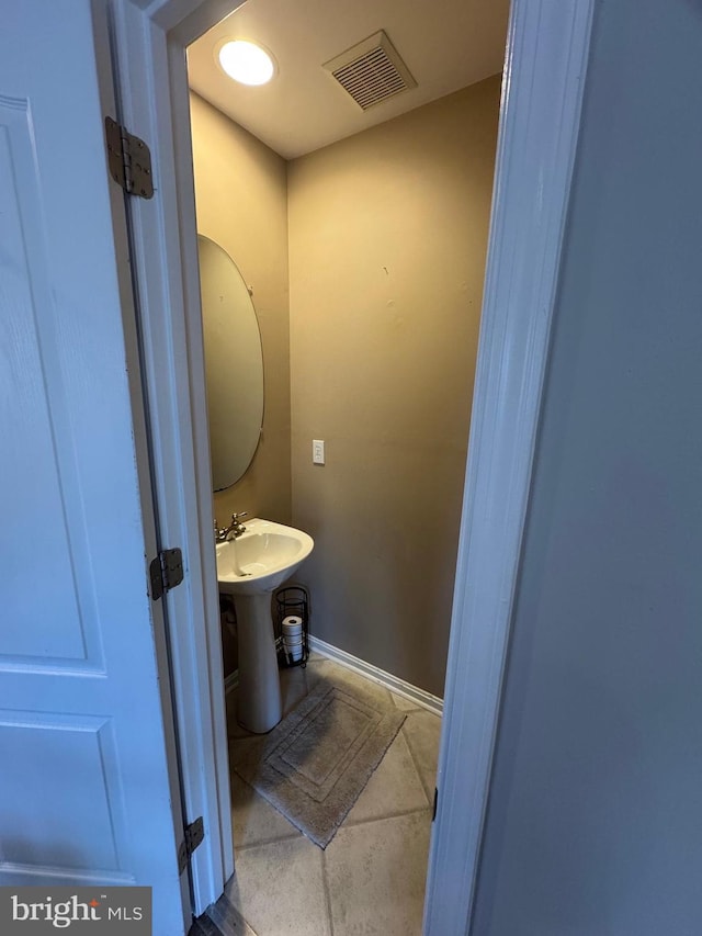 bathroom featuring tile patterned flooring and sink