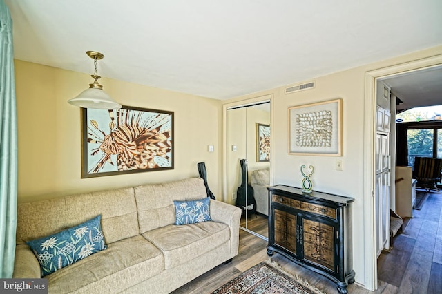 living room with dark hardwood / wood-style floors