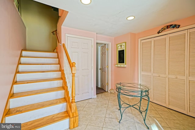 stairway featuring tile patterned floors