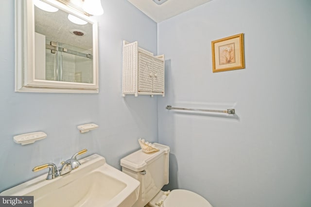 bathroom featuring sink and toilet