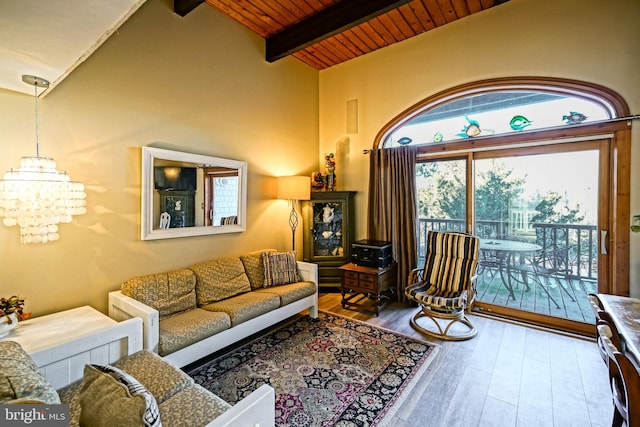 living room featuring wood ceiling, hardwood / wood-style flooring, beam ceiling, high vaulted ceiling, and a notable chandelier