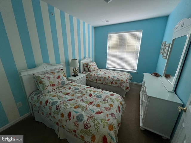 bedroom featuring dark colored carpet