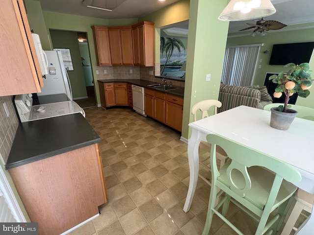 kitchen featuring ceiling fan, backsplash, dishwasher, sink, and range