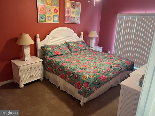 bedroom with dark carpet