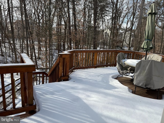 snow covered deck with area for grilling