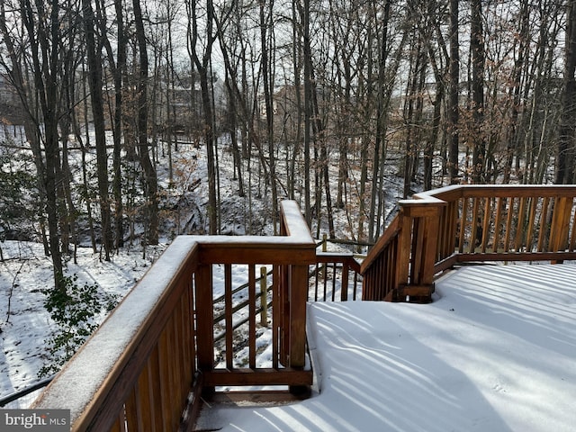 view of snow covered deck