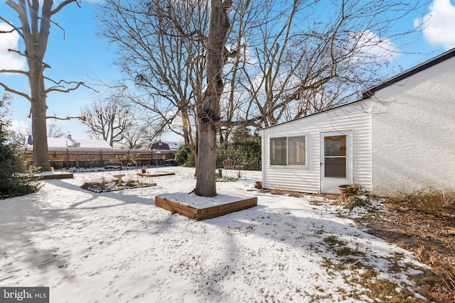 view of yard layered in snow