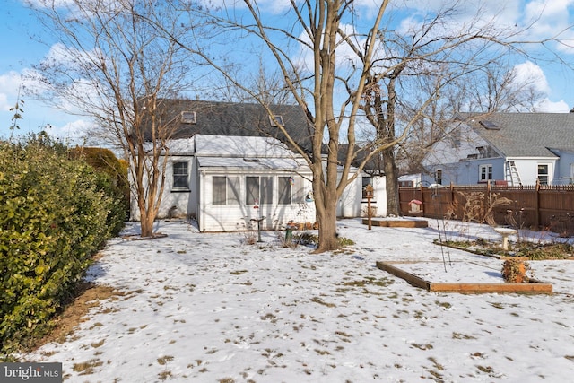 view of snow covered house