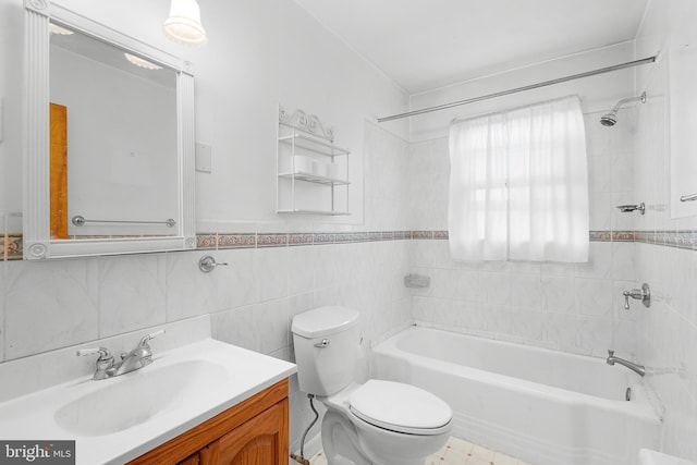 full bathroom with tiled shower / bath combo, vanity, tile walls, and toilet