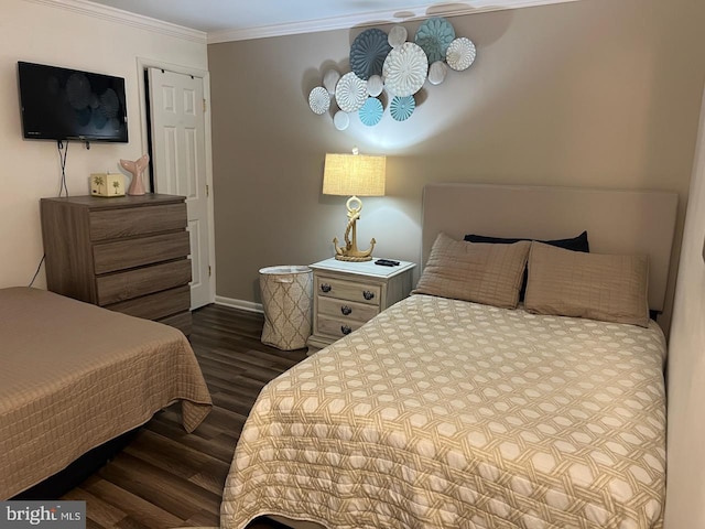 bedroom featuring dark hardwood / wood-style floors and ornamental molding