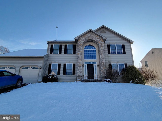 view of front of property with a garage