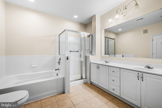 full bathroom featuring vanity, toilet, independent shower and bath, and tile patterned flooring